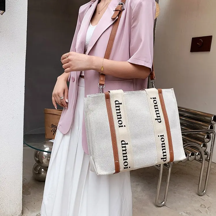 

Ladies summer new fashion casual one-shoulder messenger bag retro solid color canvas handbag large capacity letter handbag