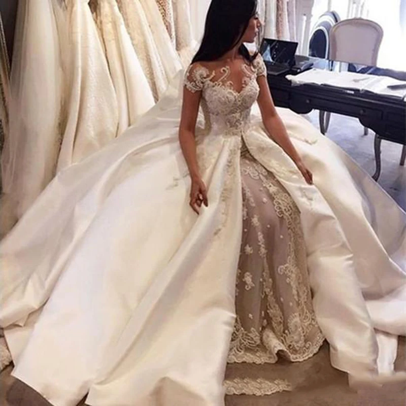 

Luxury Ball Gown Wedding Dresses 2020 Saudi Arabia Cap Sleeve Lace Applique Satin Overskirt Bridal Gowns Custom Made Dubai Weddi