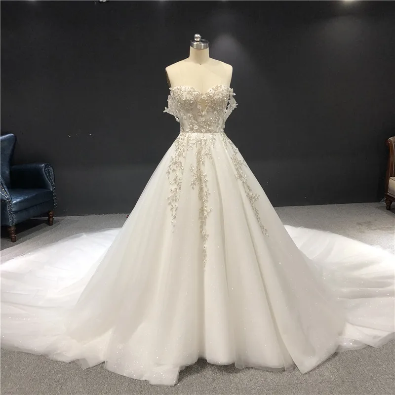 

2021 Newest High Quality Real Sample Ivory Sweetheart Strapless A-line Heavy Silver Beadings Floor Length Wedding Dress