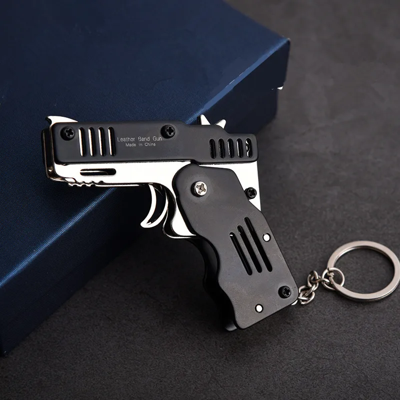 

Mini Folding Can Hold The Key Chain Of The Rubber Band Gun Made All Metal Six bursts Guns Shooting Toy Gifts Boys Outdoor tools
