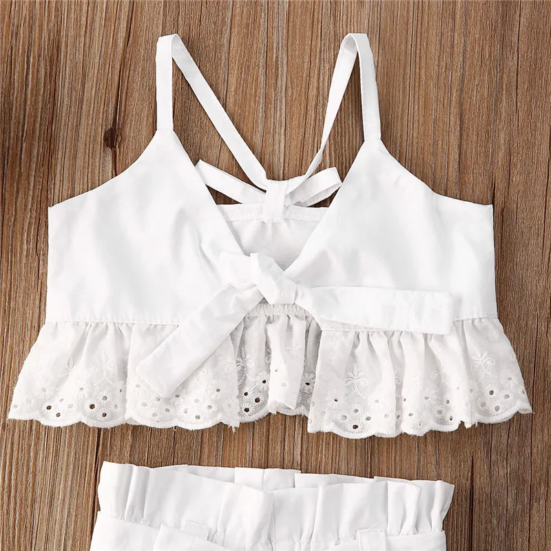 

2020 Summer Infant Kids Girls Clothes Set Ruffles Lace Solid Sleeveless Strap Bow Belt Vest Tank Crop Tops Shorts Pants 2PCS New