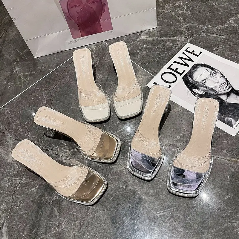 

Ladies slippers outer wear summer new trend simple transparent square heel temperament girlish crystal high-heeled slippers.