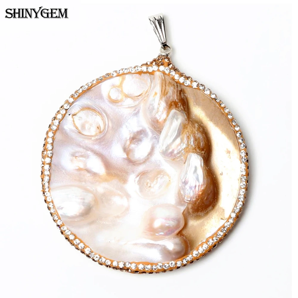 подвеска с жемчугом. украшения с ракушками. подвеска с жемчужиной из устрицы. подвеска с натуральным жемчугом. кулончик с жемчужиной в ракушке.