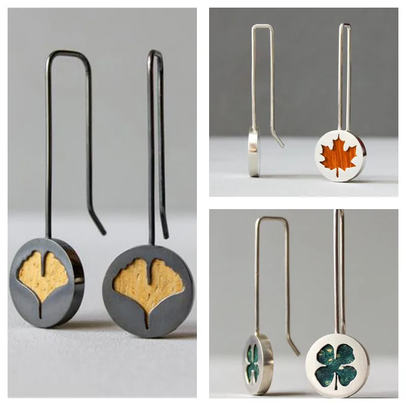 

Bohemian Retro Long Carved Oil Dripping Clover Maple Leaf Earrings Fashion Simple Silver White Metal Party Women's Earrings
