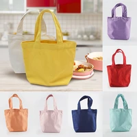 solid color canvas bento student lunch box bag cosmetic hand holding small square bag bag solid color lunch box bag