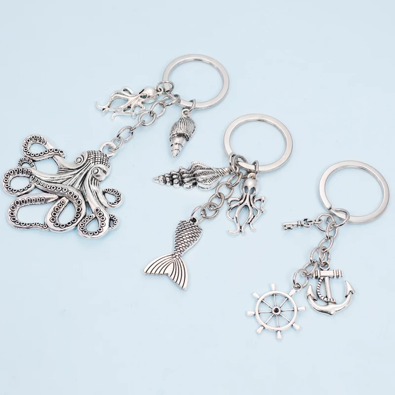 

Marine animal series Alloy Key chain Pendant Shell Conch Mermaid Octopus Dolphin Keychain Combined Keyring of Rudder and Anchor