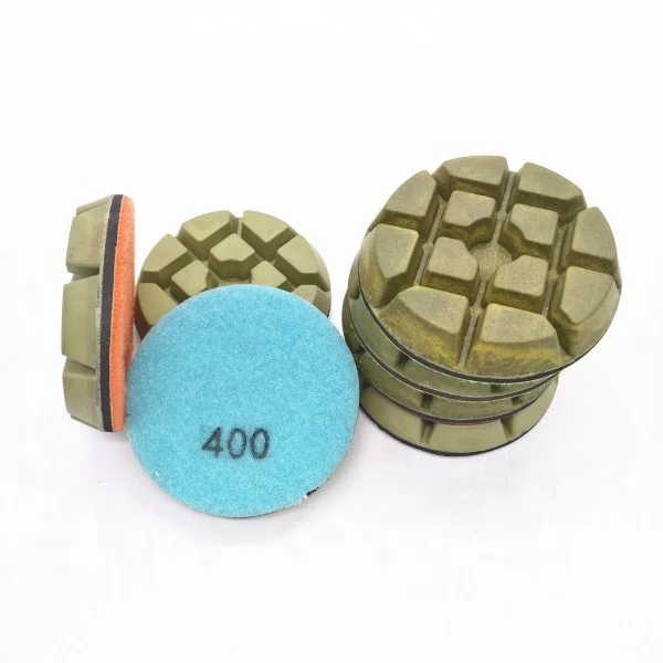 

Resin polishing puck for concrete floor