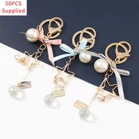 50pcs 2021 fashion metal star ribbon bow pendant keychain womens popular backpack key ring campus accessories supplied