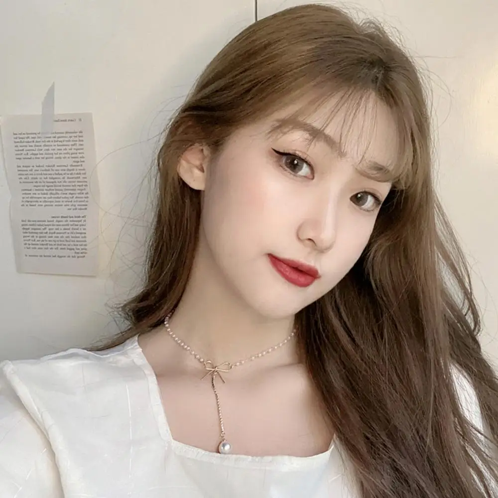 Элегантное модное ожерелье на длинной цепочке с жемчугом и бантом. Простая мерцание циркона.