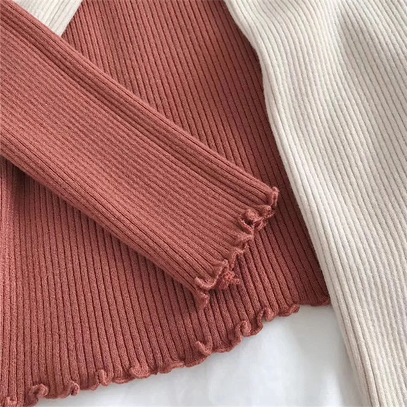 Женский свитер с воротником-хомутом вязаный высоким эластичным поясом