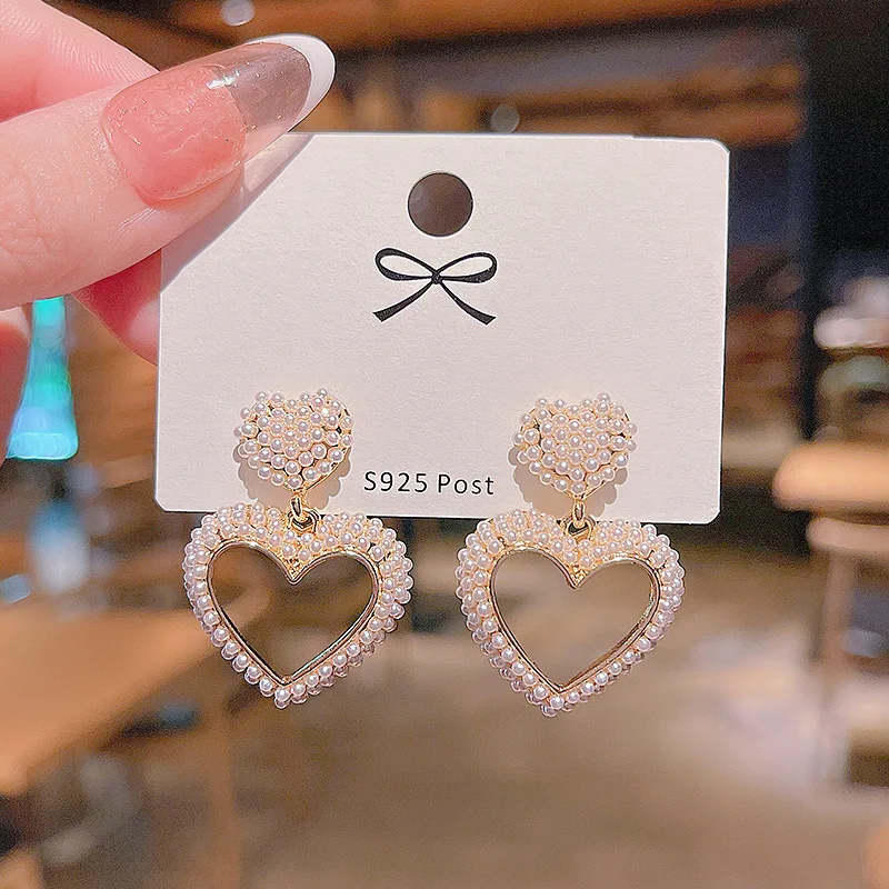 

French high-end love pearl earrings Korean niche s925 silver needle earrings female net red temperament simple earrings