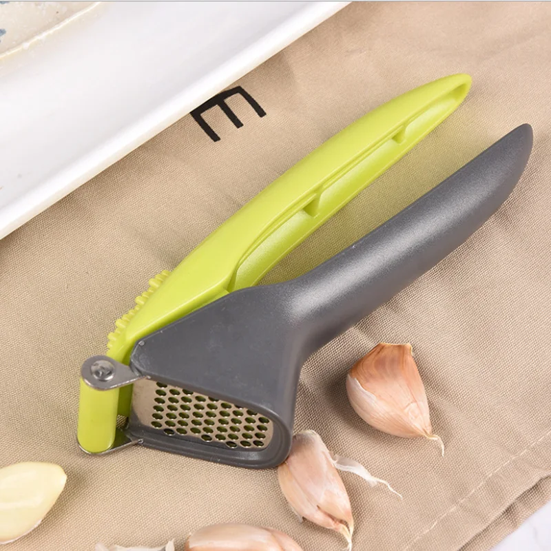 

Stainless Steel Garlic Masher Plastic Hand Grip Labor-Saving Design Garlic In Seconds Uniform Round Hole Kitchen Artifact Tools
