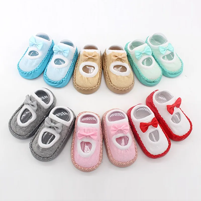 Теплые нескользящие носки тапочки для малышей осенние хлопковые с бантом
