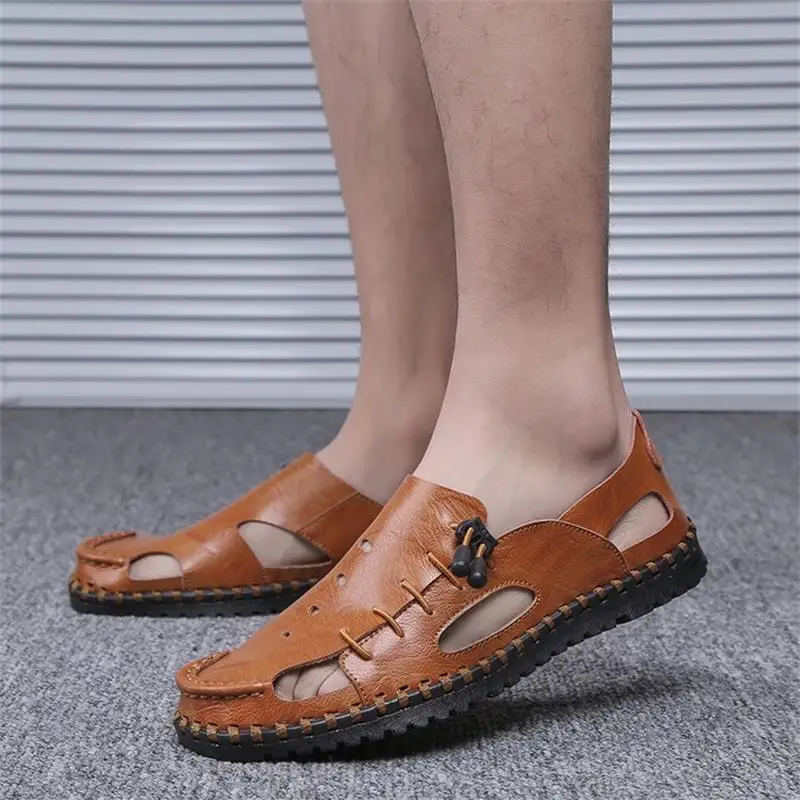 

2021 New Men Shoes Solid Color PU Hollow Breathable Creative Hand-stitched Side Elastic Band Fashion Casual Sandals 3KC280