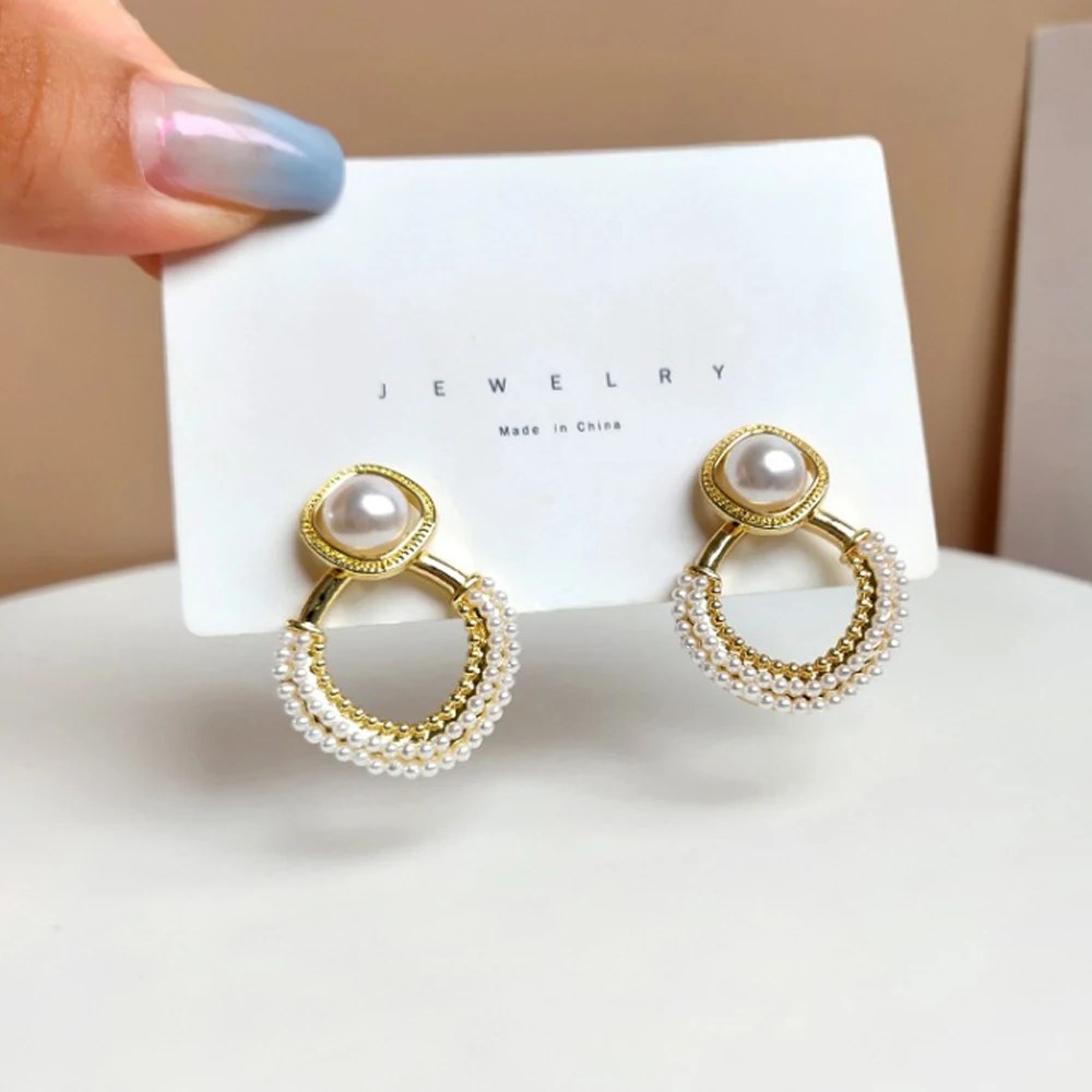 

Han Edition Stud Earrings Geometric Shape Of Hollow Out Imitation Pearl Earrings Exaggerated Style Female Temperament Gifts