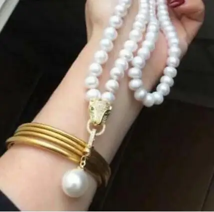 

CHARMING AAA 9-10MM NATURAL SOUTH SEA WHITE PEARL NECKLACE LENGTH 34" + PENDANT