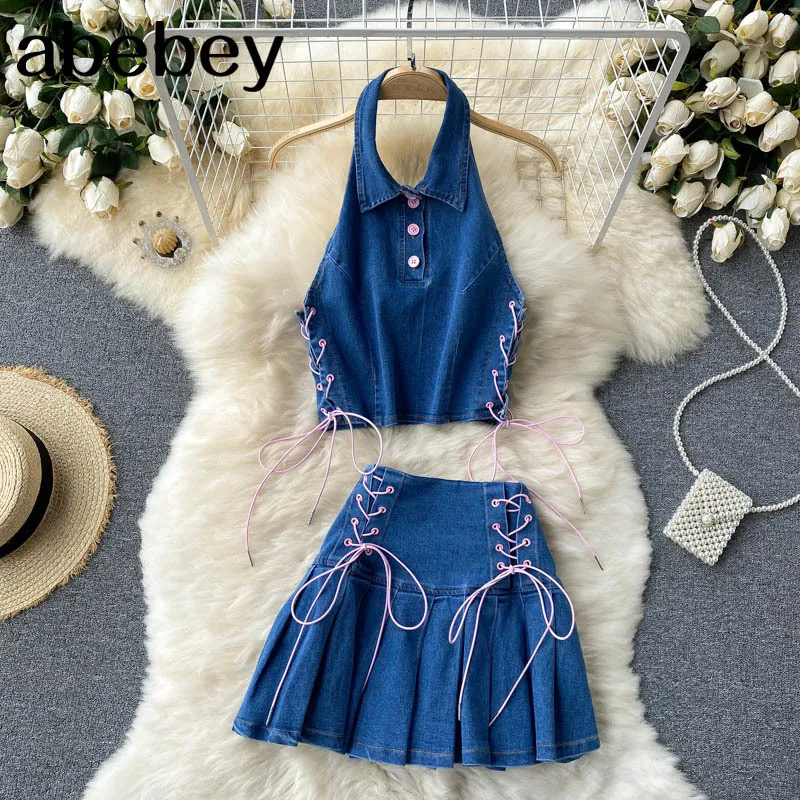 

Женский джинсовый костюм в стиле ретро, пикантный короткий топ без рукавов с открытой спиной и лямкой на шее и мини-юбка трапециевидной форм...