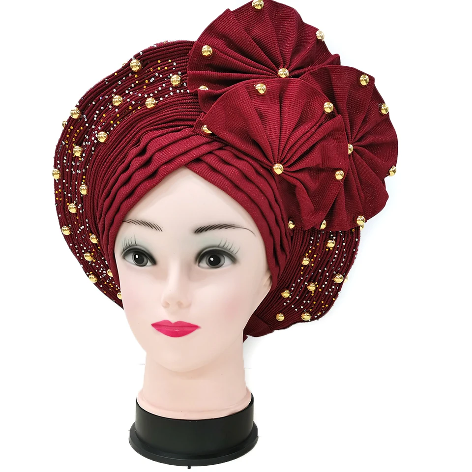

Африканская Aso Oke уже сделала автомобильные колпачки головного убора