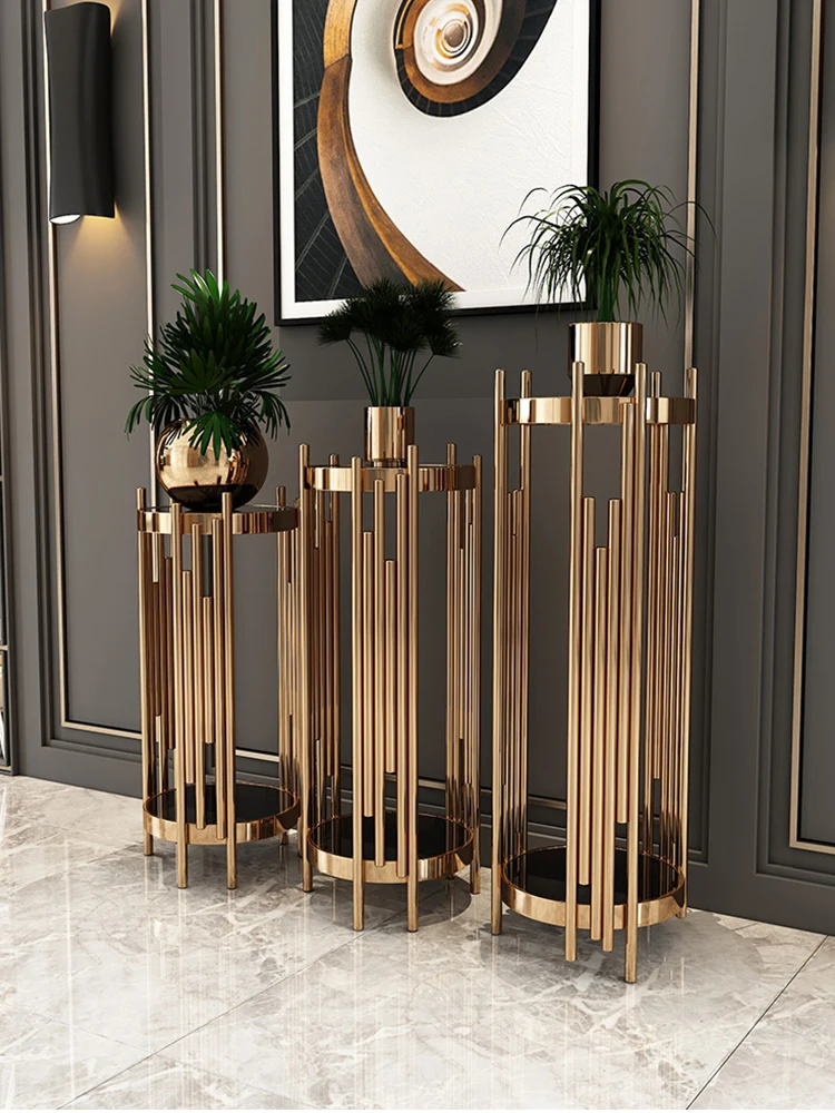 

Stainless steel flower shelf shelf living room TV cabinet next to the simple floor marble flower shelf ornaments