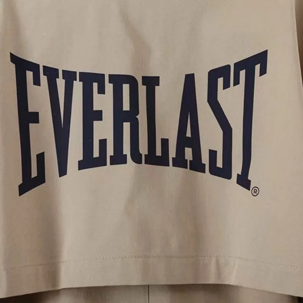 

2021 spring new women's lapel button decoration loose casual mid-length printed pattern windbreaker jacket