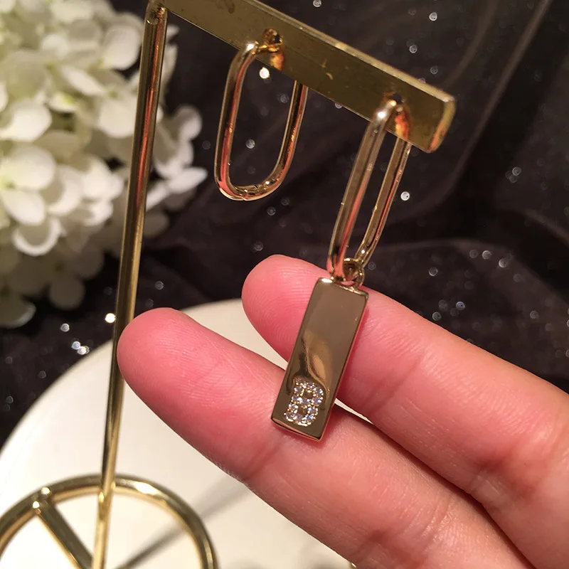 

Geometric sequin earrings asymmetrical letters simple cold wind ins tidal tetralateral tassel earrings