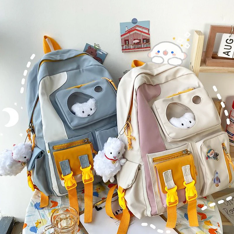 

Ita Backpack Is A Waterproof Nylon School Backpack for Teen Girls Fresh and Cute Color Matching Badge Doll Casual Shoulder Bag