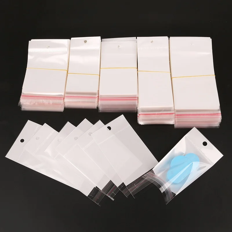 

Select Size 6x14cm/7x14cm/8x14cm/6x17.5cm/8x17.5cm 100Pcs White Self-Adhesive Plastic Storage Bag For Jewelry Packaging Gift Bag