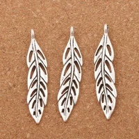 hollow long feather charms pendants jewelry l308 54x10 3mm 15pcs zinc alloy tibetan silver