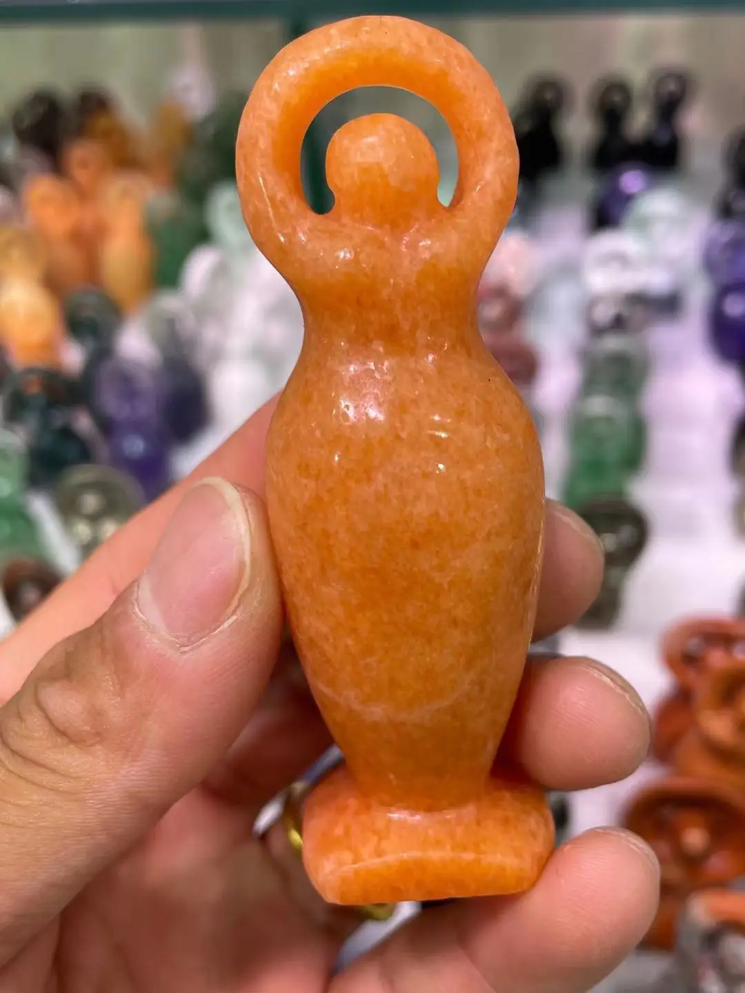 

Natural hand carved orange Crystal figurine pendant of Donglin Mining God