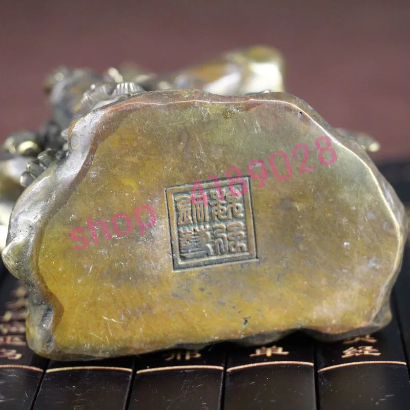 

Pure copper, sitting on stone Guanyin, handicraft decorations.