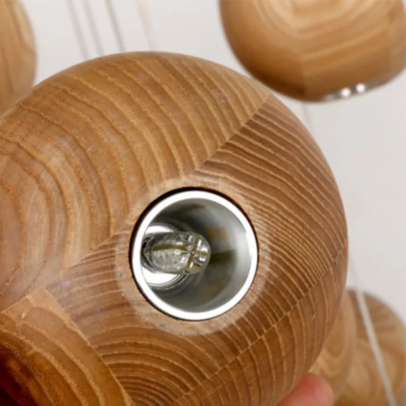 

In the Nordic art creative personality hotel living room lighting log wood ball LED simple restaurant chandelier