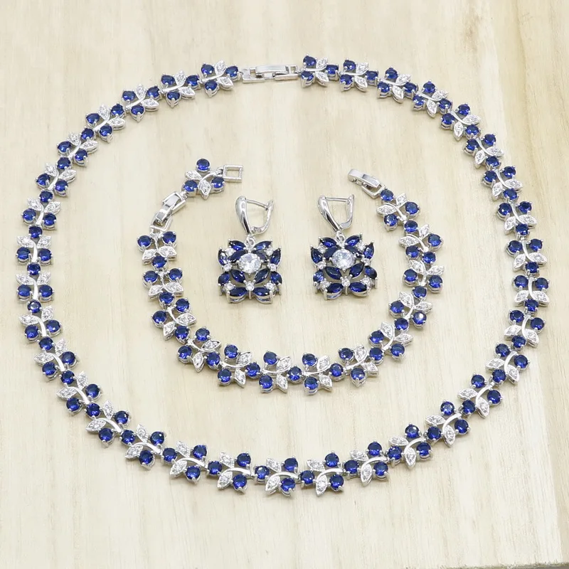 Темно синего цвета с украшением в виде кристаллов цветок Форма серебро Цвет