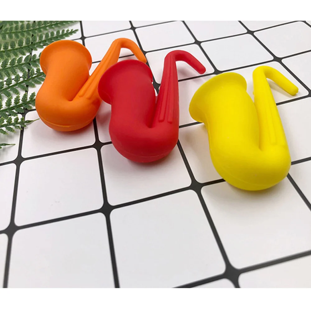 

3pcs Spill-proof Pot Lid Rack Overflow Stoppers Pot Cover Lifter Horn Saxophone Shape Silicone Material for Kitchen (Red + Yello