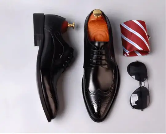 Мужские модельные туфли из воловьей кожи на низком каблуке с резным узором