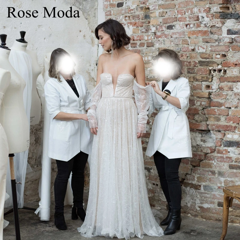 

Rose Moda Deep V Neck Off Shoulder Long Sleeves Sequined Lace Boho Wedding Dress Ivory and Champagne Bridal Gown