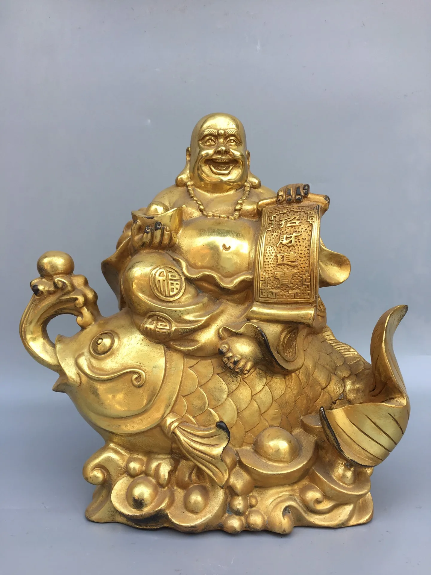 

11"Chinese temple collection Old Bronze Gilt Maitreya Buddha Statue Riding a carp statue Lucky fortune Ornaments Town House