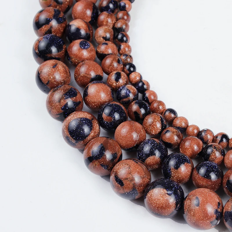 Бусины из натурального камня красные темно-синие мелкого песка для
