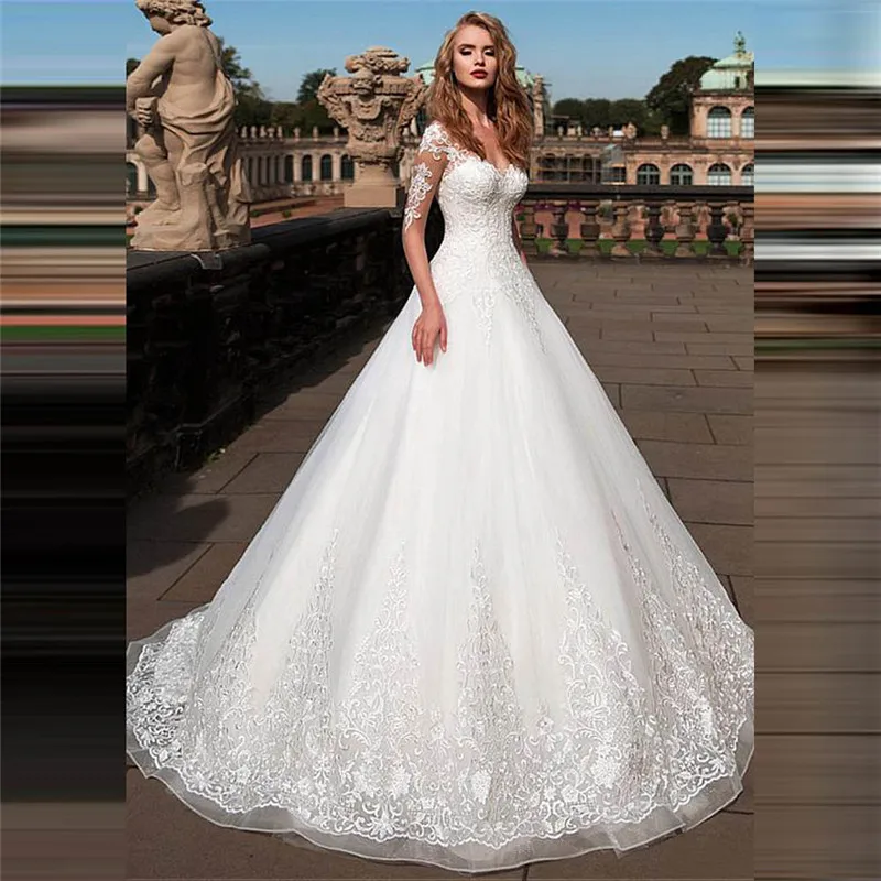 

Платье Свадебное ТРАПЕЦИЕВИДНОЕ с длинным рукавом, кружевной аппликацией и глубоким декольте