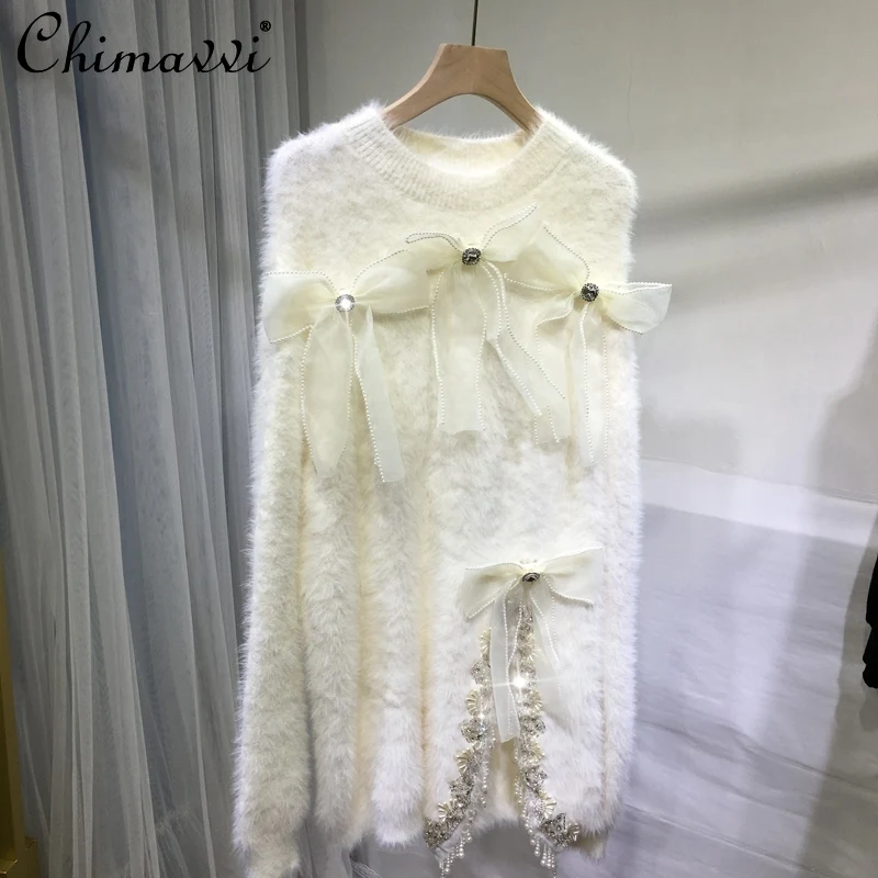 

Свитер в европейском стиле с тяжелыми бусинами женская зимняя одежда 2021 Модные свободные приталенные белые вязаные топы средней длины из м...