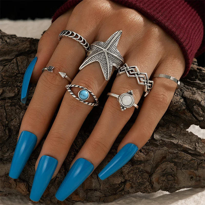 

Docona 7pcs/set Boho Blue Gem Opal Rings for Women Charming Starfish Geometric Joint Midi Ring Set Ladies Jewelry Anillos 16828