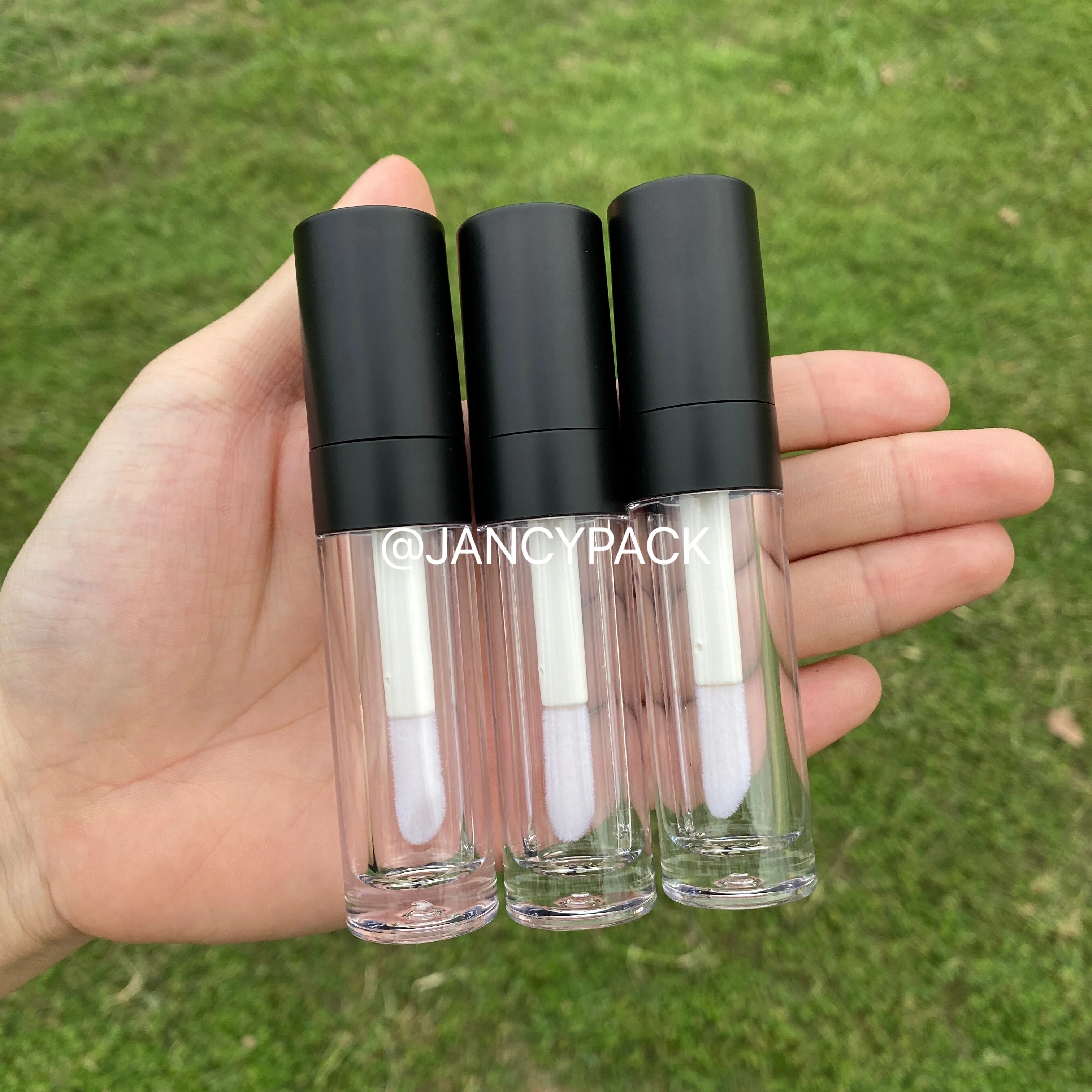 

Wholesale 5.5ml matte black thick wand lip gloss tubes clear liquid lipstick tubes round custom logo lipgloss packaging stoppers