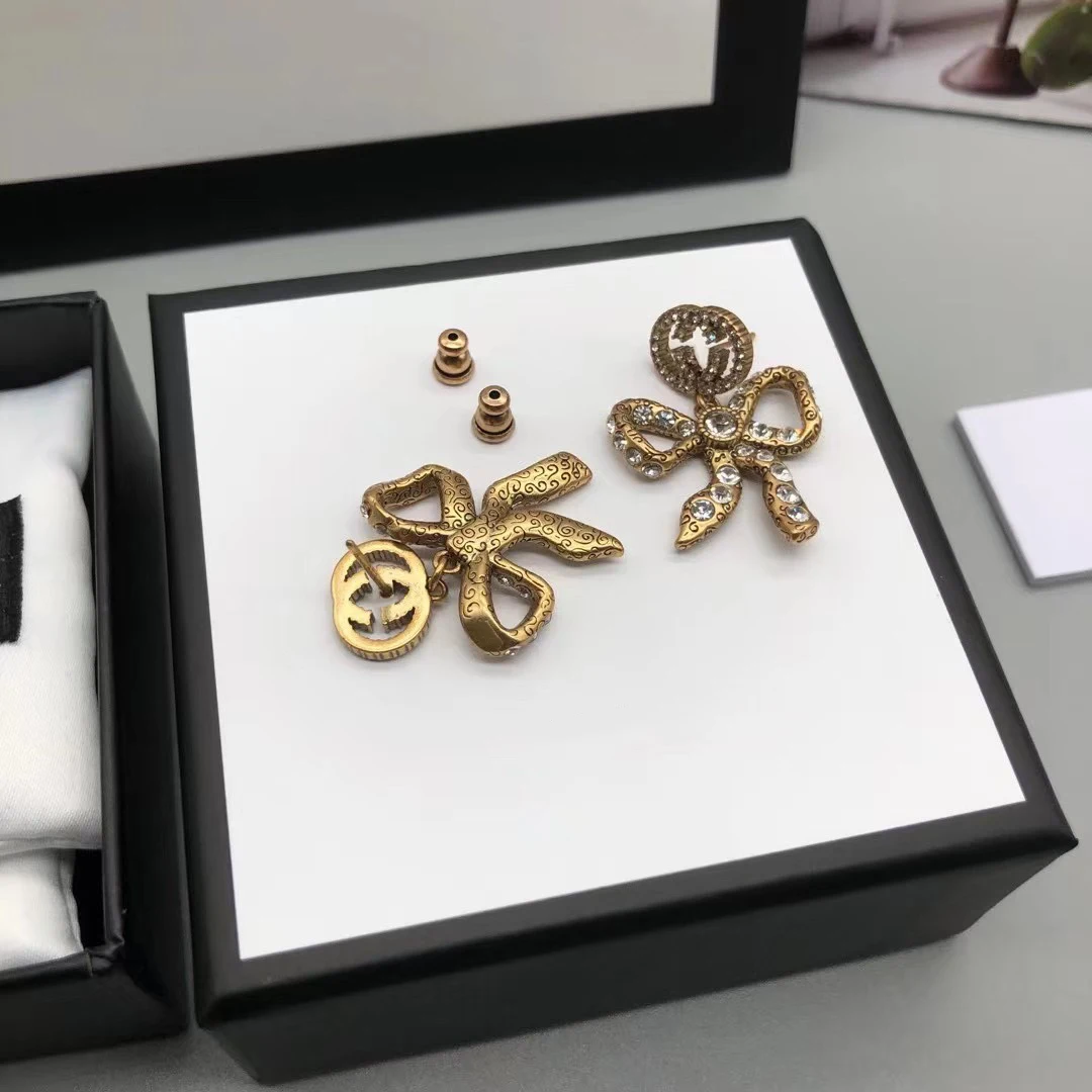 

Brass silver needle classic logo G letter butterfly earrings ladies fashion personality trend holiday gifts