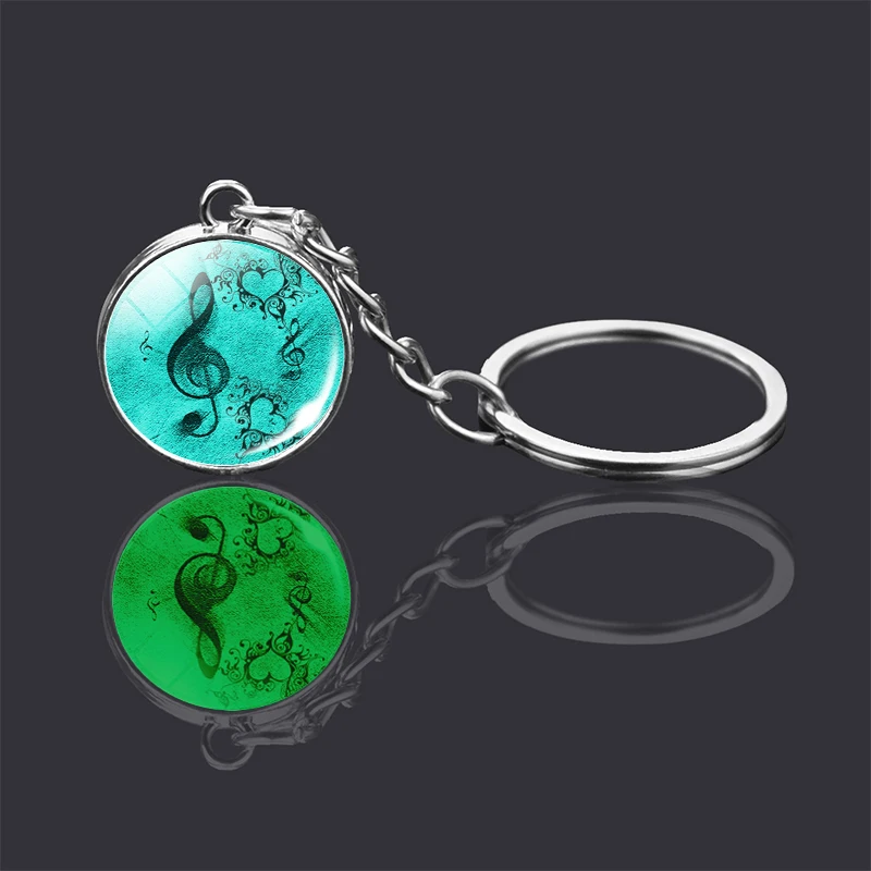 Световой с музыкальными знаками брелок двухсторонний стеклянный шар в виде