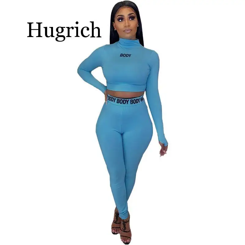 

Женский спортивный костюм из двух предметов с буквенным принтом, укороченный топ с высоким воротником и длинными рукавами + облегающие штан...