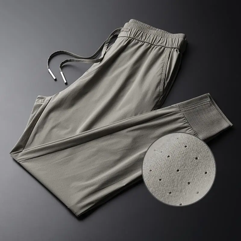 

Summer thin casual pants men's nine point Harem Pants middle-aged and young men's hollow out breathable elastic neckband pants