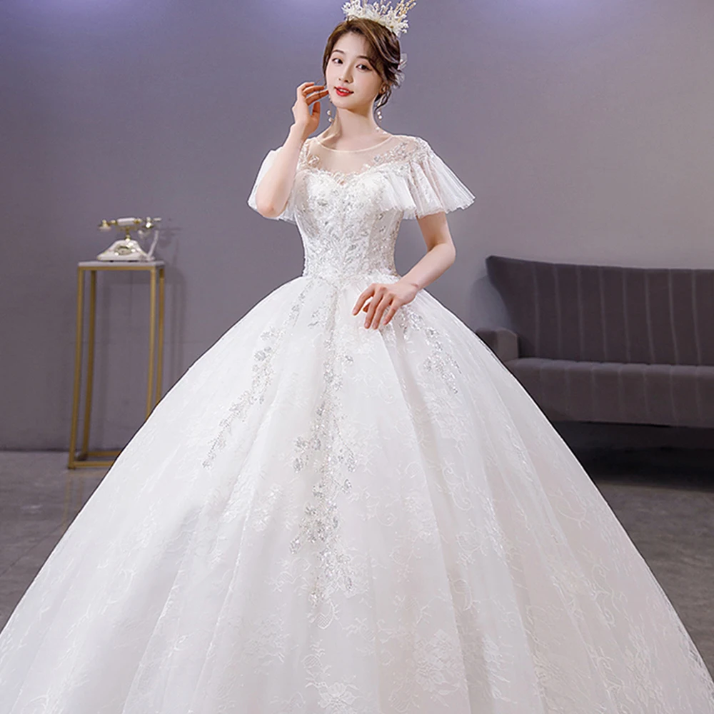

Dioflyusa Embroidery Sequins O Neck Wedding Dress Women Flare Sleeve Lace Up A-line Gown White Slim Bride Dress Vestido De Noiva