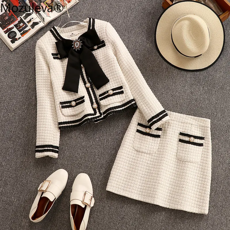 Женский шерстяной костюм из двух предметов куртка с большим бантом и мини юбка