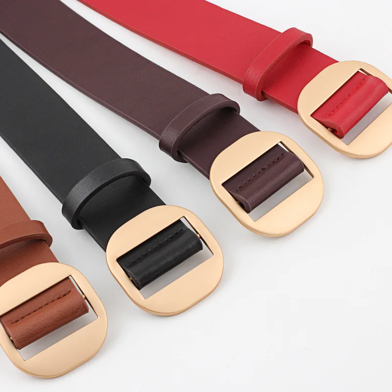 Женский непористый декоративный пуховик с круглой пряжкой и ремнем из