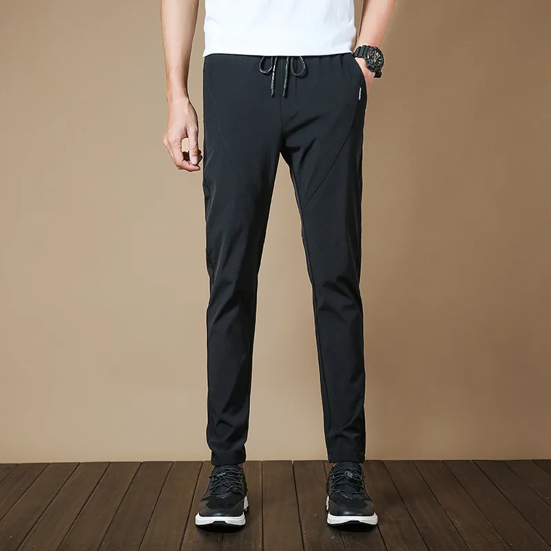 

Men's 2021 spring and autumn new casual pants Korean Trend slim Leggings ice silk breathable sports pants men's pants