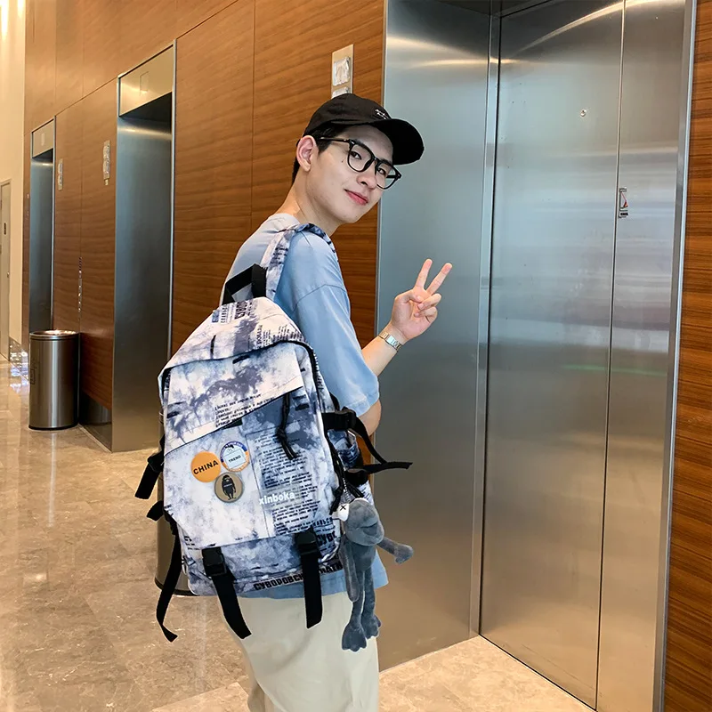 Japanese fashion backpack men's 2022 new Korean fashion casual high-capacity student backpack junior high school bag. purses